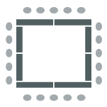 tables arranged in a square formation with chairs around them